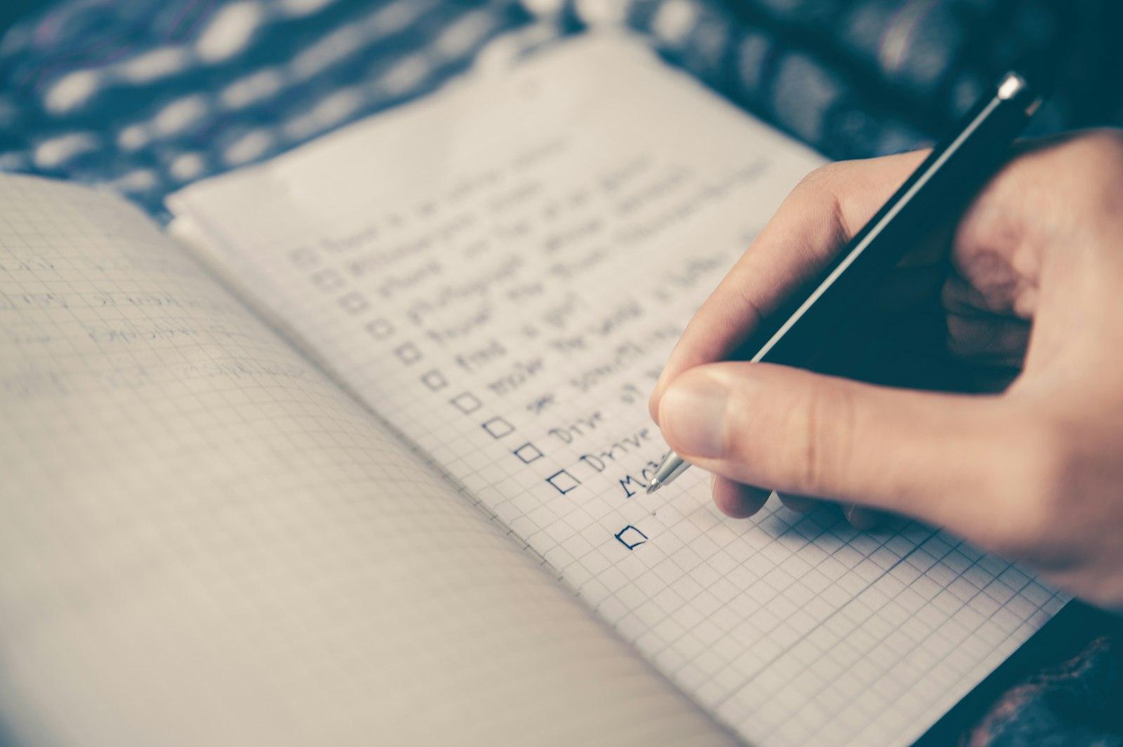 Checklist notebook representing AI meeting notes and action items