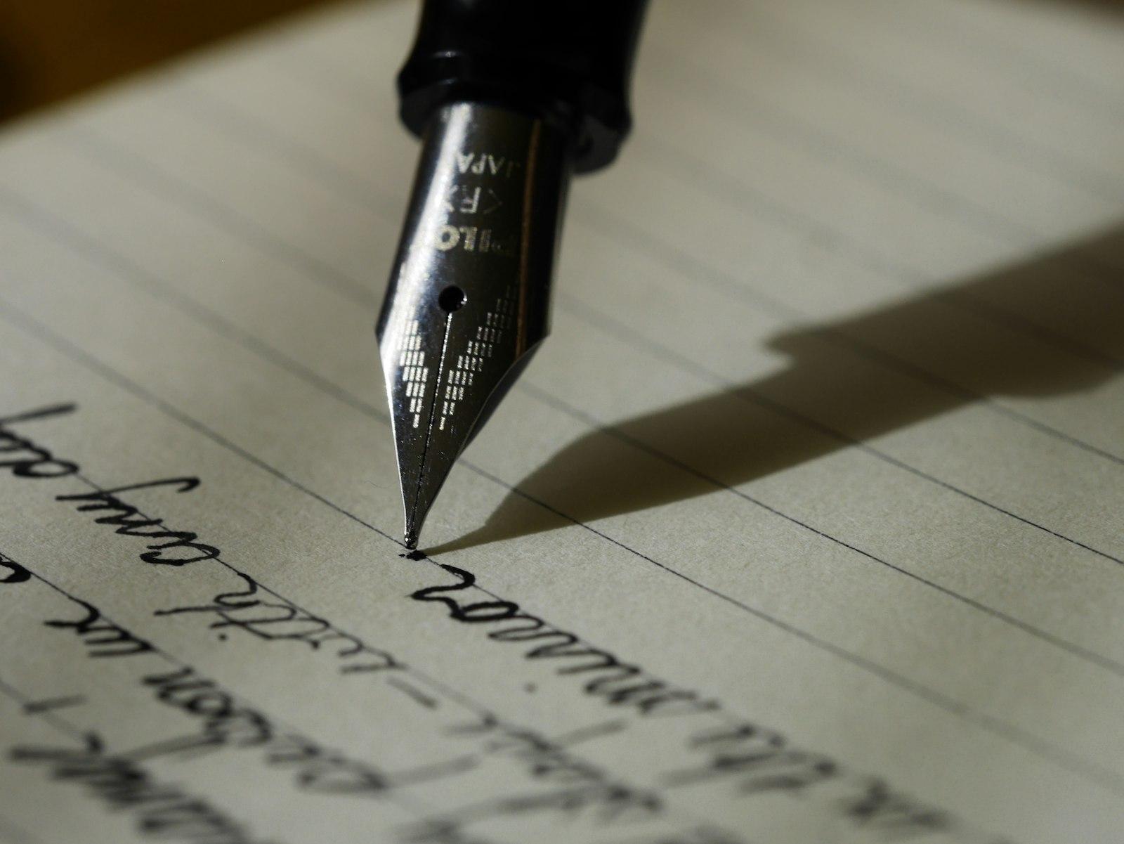 Handwriting in a notebook illustrating turning speech into written text